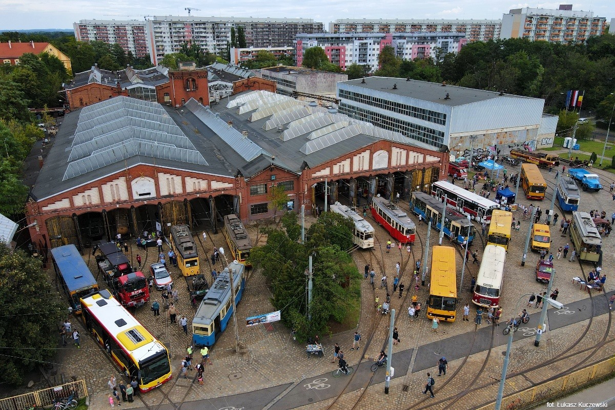 The depot area with trams, buses and people captured form above