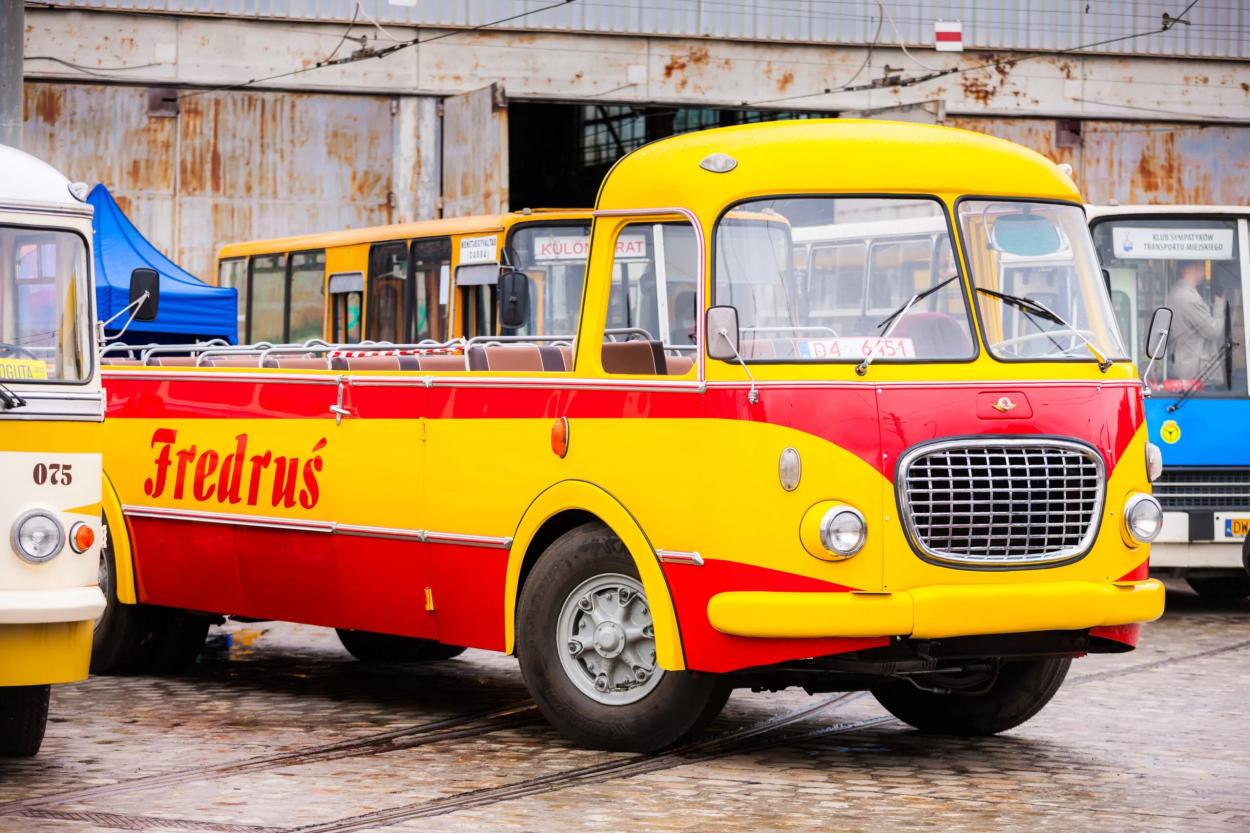 Image of a yellow convertible bus