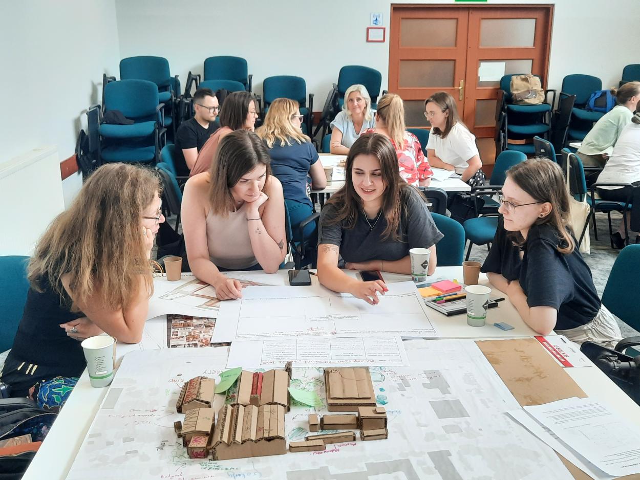 a group of people working together at the table