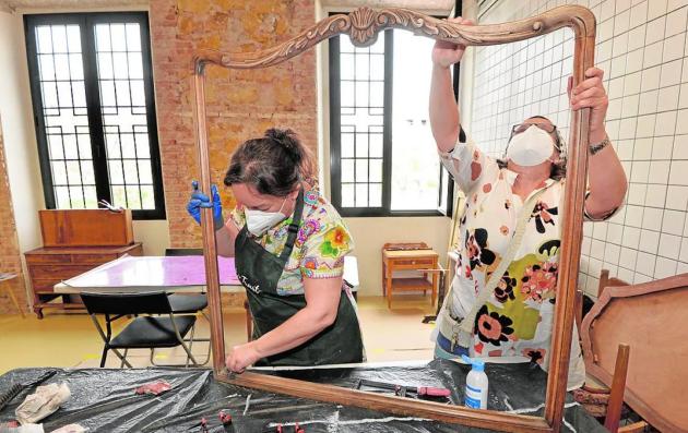 People working on a frame