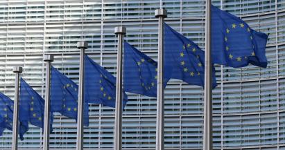 European Union flags at the European Commission Berlaymont building.