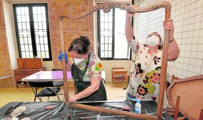 People working on a frame